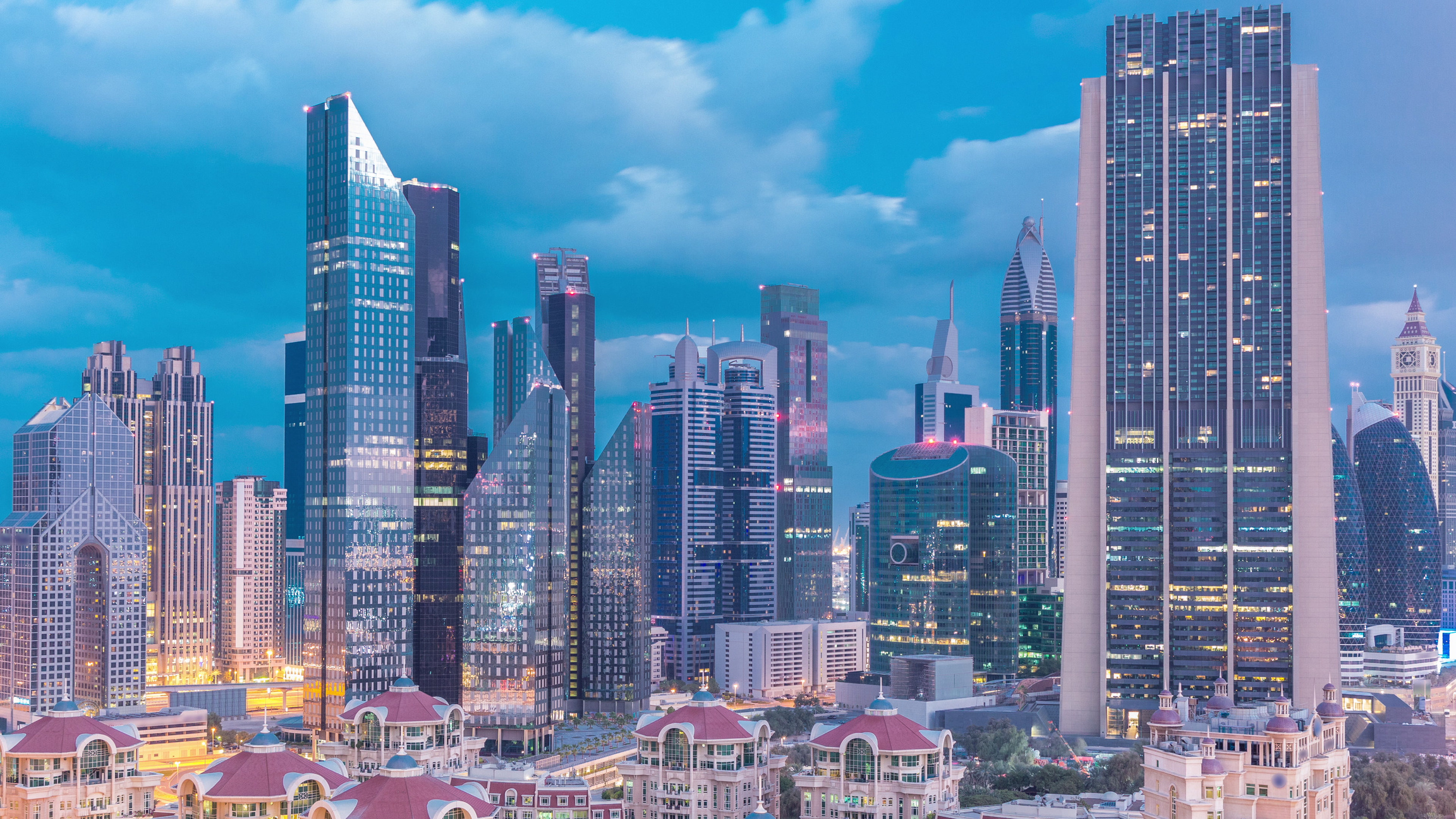 Skyline view of the buildings of Sheikh Zayed Road and DIFC night to day timelapse in Dubai, UAE